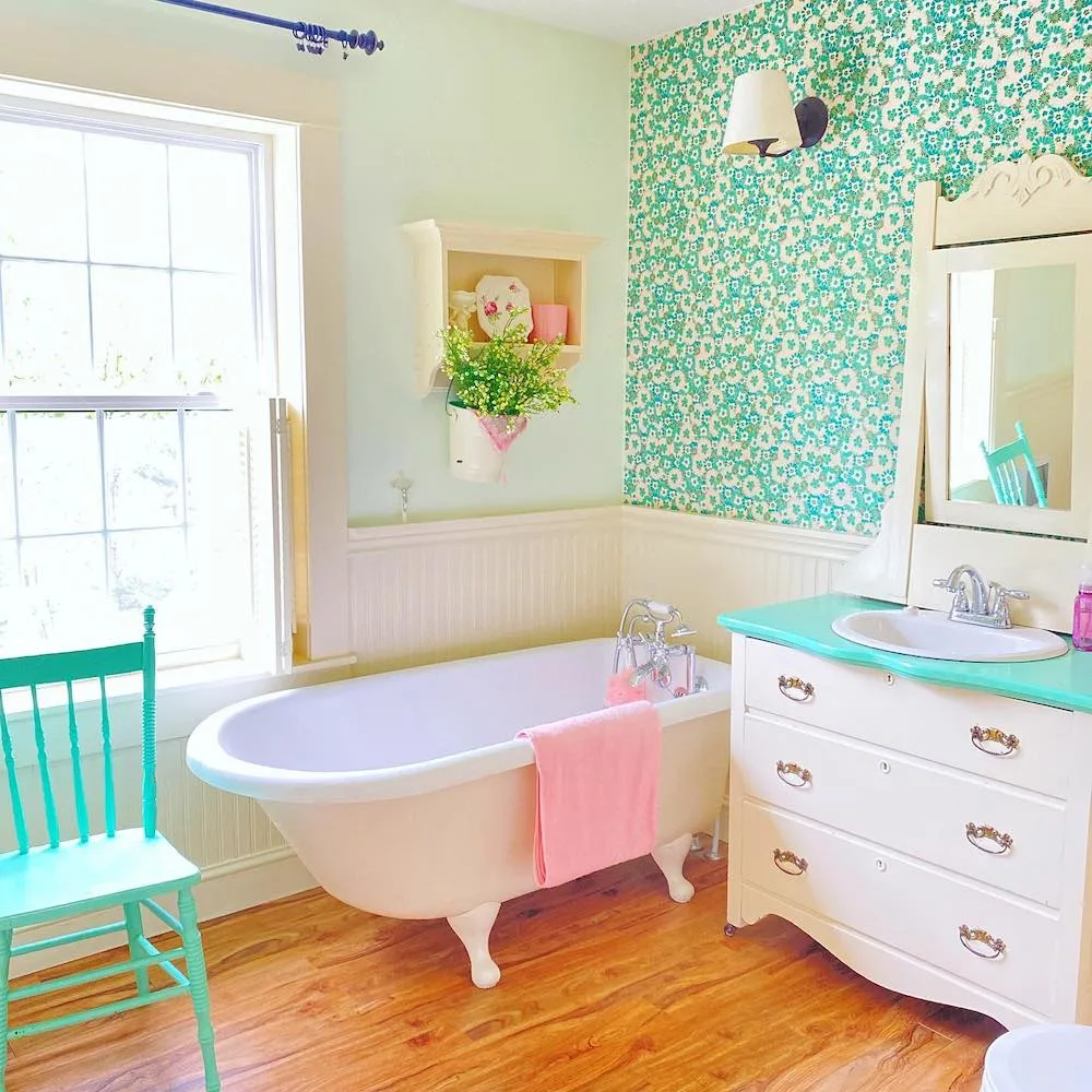 Bathroom with green wallpaper