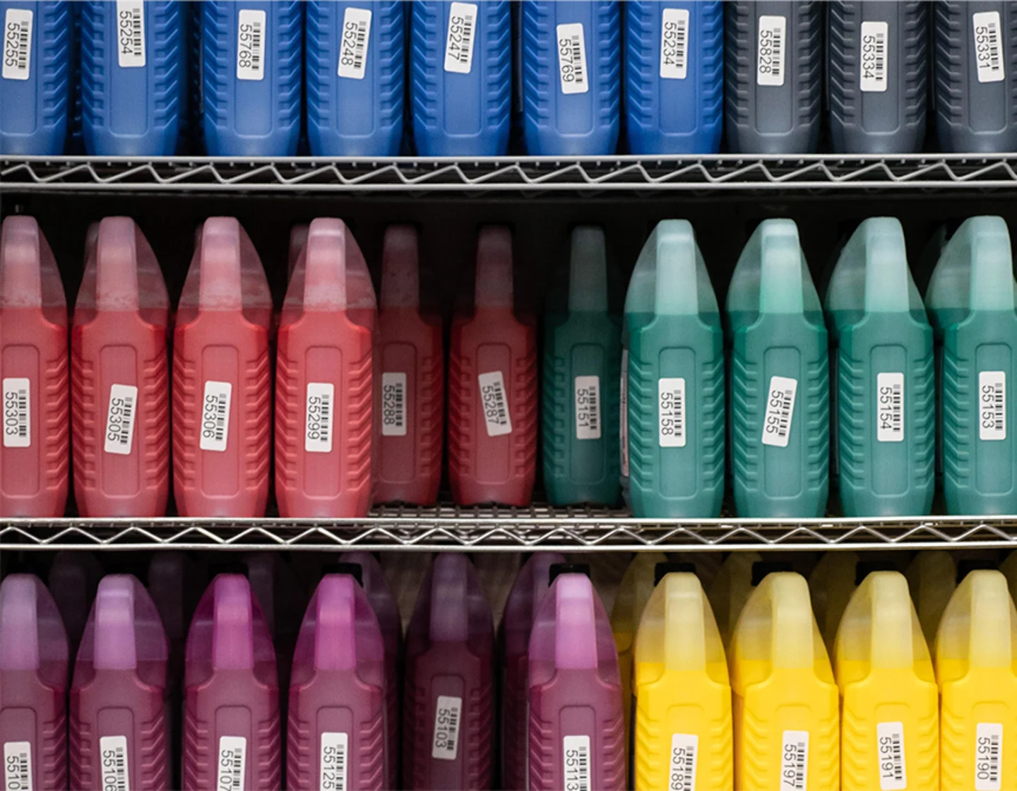 Shelf with big jugs of ink