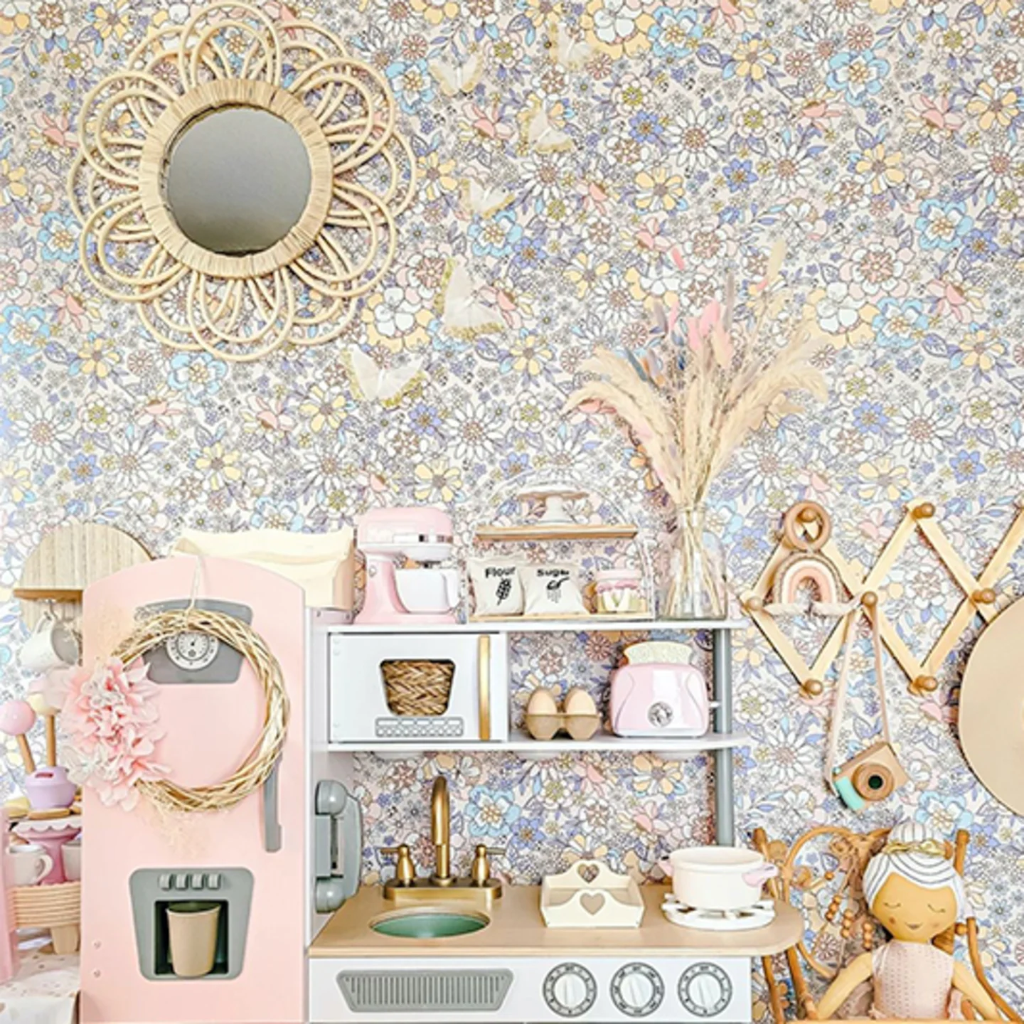 Floral Wallpaper behind a kids play kitchen.