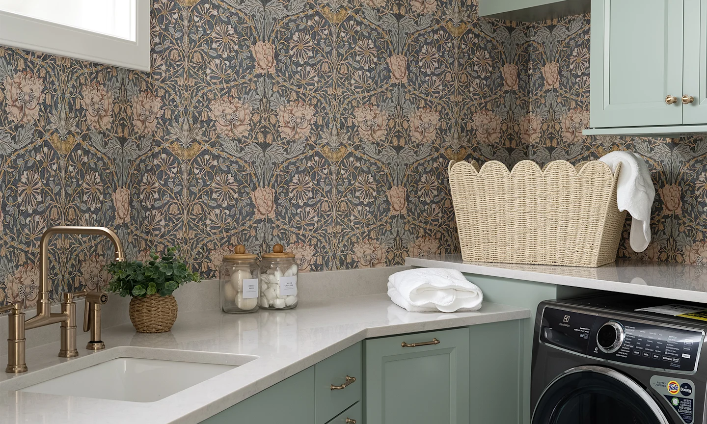 Laundry room with William Morris Honeysuckle wallpaper.