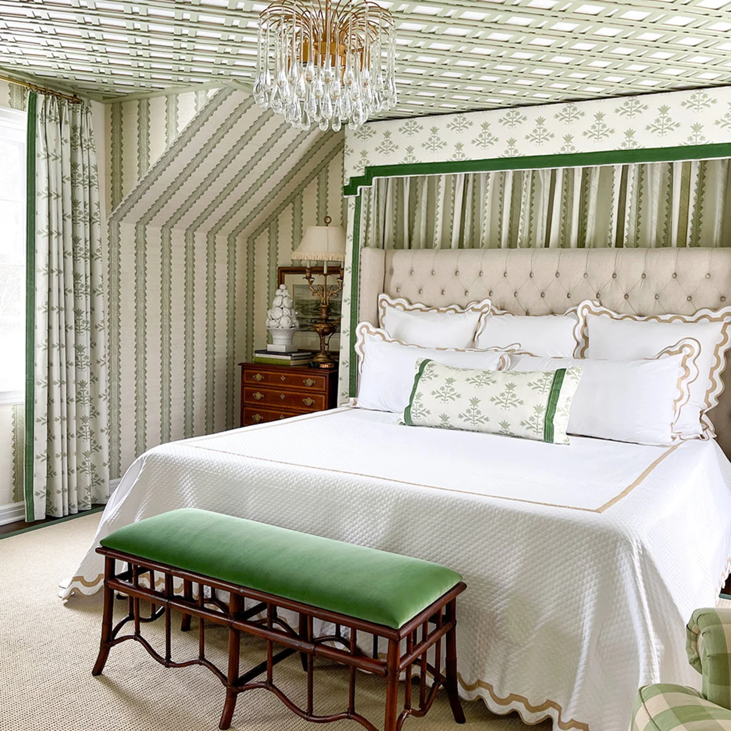 Bedroom with green wallpaper.