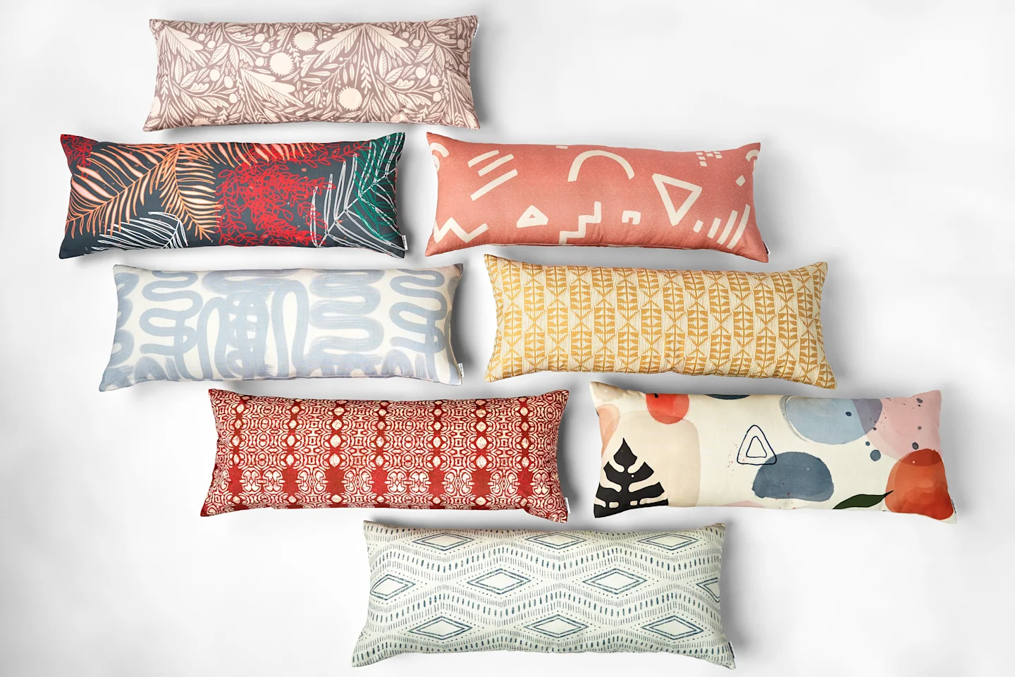 Multiple colorful extra long lumbar pillow