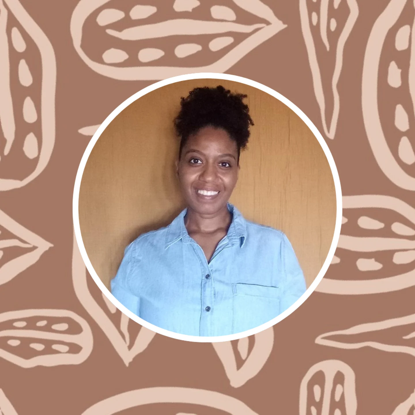 Headshot of Annette Brown with one of her prints in the background.